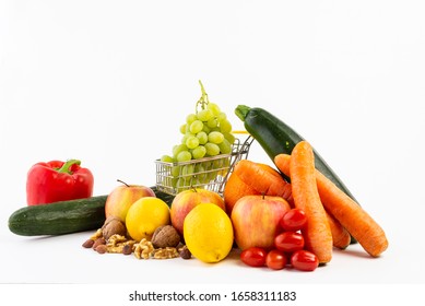 Healthy fruits and vegetables against white background