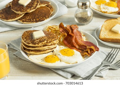 Healthy Full American Breakfast with Eggs Bacon and Pancakes