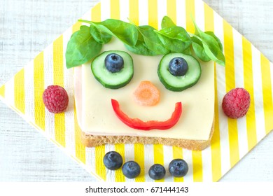 Healthy and fun food for kids, happy and funny face sandwich - Powered by Shutterstock