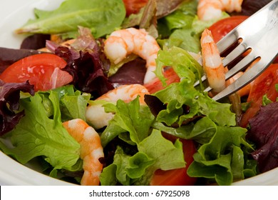 A Healthy Green Garden Salad With Cooked Shrimp