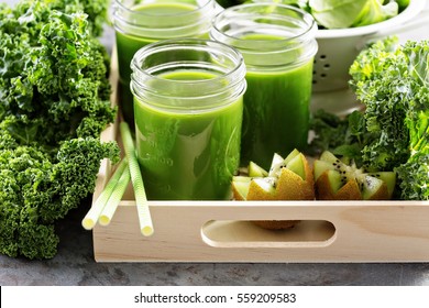 Healthy Green Kale And Fruit Juice In Mason Jars