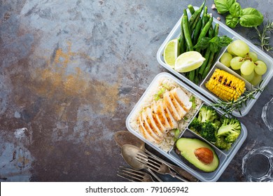 Healthy Green Meal Prep Containers With Chicken, Rice, Avocado And Vegetables Overhead Shot With Copy Space