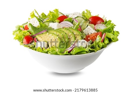 Healthy green salad with avocado feta cheese and fresh vegetables isolated on white