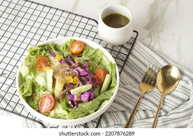 Healthy Green Salad With Chicken Breas, Fusilli Pasta, Tuna Mayo, Tomatoes, With Boiled Egg With Sesame Dressing And Olive Dressing Isolated On White Background