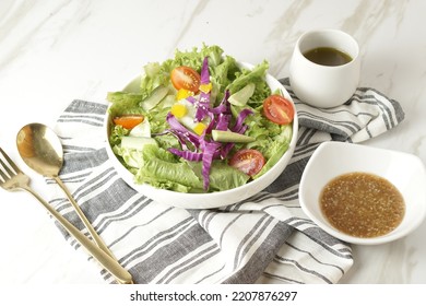 Healthy Green Salad With Chicken Breas, Fusilli Pasta, Tuna Mayo, Tomatoes, With Boiled Egg With Sesame Dressing And Olive Dressing Isolated On White Background