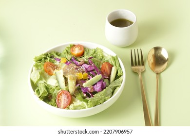 Healthy Green Salad With Chicken Breas, Fusilli Pasta, Tuna Mayo Isolated On Green Background