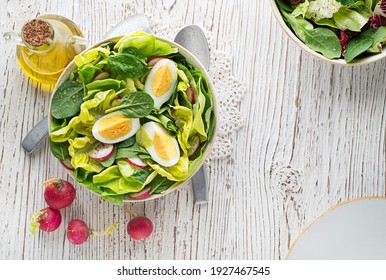 Healthy Green Salad With Egg On Wooden Table Background. Healthy Meal.