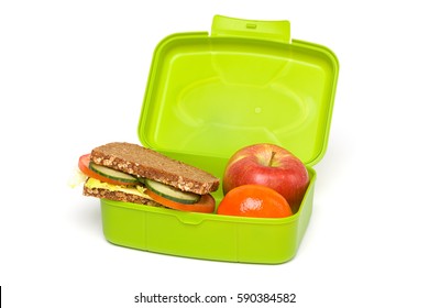 Healthy Green School Lunch Box, Isolated on White, with Whole-grain Bread and Fruit - Shutterstock ID 590384582