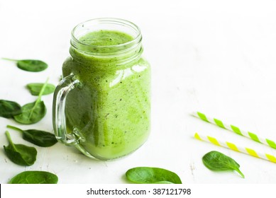 Healthy green smoothie and ingredients on white - spinach, apple and kiwi. Superfood, detox and  healthy food. - Powered by Shutterstock