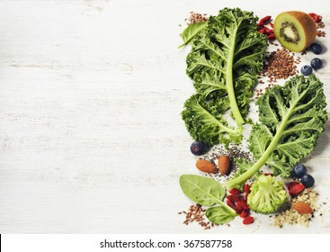 Healthy green smoothie or salad ingredients on white - superfoods, detox, diet, health or vegetarian food concept. Background layout with free text space. - Powered by Shutterstock