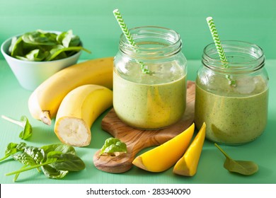 Healthy Green Smoothie With Spinach Mango Banana In Glass Jars