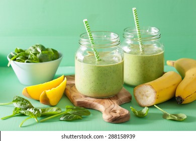 Healthy Green Smoothie With Spinach Mango Banana In Glass Jars