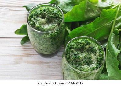 Healthy Green Sorrel And Spinach Smoothie In Glass Jar With Wooden Background. Close Up. Concept Of Healthy Food. Natural Detox