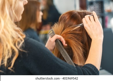 Healthy hair tips. Cropped shot of a female client receiving a haircut at the local beauty salon - Powered by Shutterstock