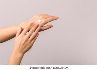 Healthy Hands Of A Young Woman Applying Moisturizer. Skincare Concept Beauty Photoshoot