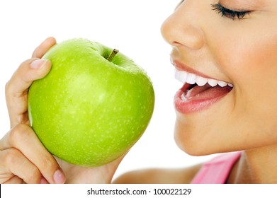 Healthy happy woman eating apple close macro