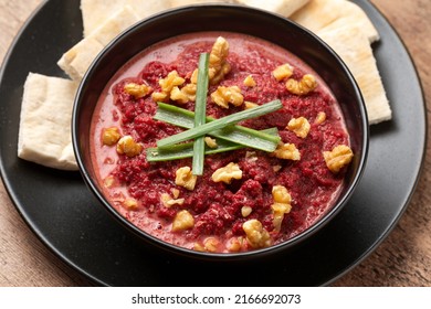 Healthy Homemade Beetroot Dip Sauce Hummus, In Rustic Clay Bowl Served With Pita Bread, Walnuts And Parsley