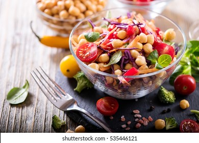 Healthy homemade chickpea and veggies salad, diet, vegetarian, vegan food, vitamin snack - Shutterstock ID 535446121