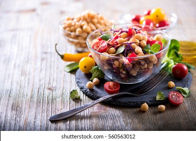 Healthy homemade chickpea and veggies salad, diet, vegetarian, vegan food, vitamin snack - Shutterstock ID 560563012