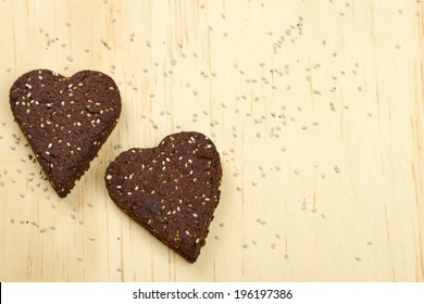 Healthy Homemade Dark Chocolate Chia Seed Love Heart Cookies On A Wooden Background