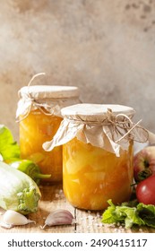 Healthy homemade fermented food. Salad with courgette (zucchini) and vegetables on a rustic table. Home economics, autumn harvest preservation. Copy space.