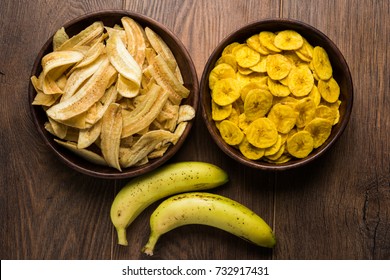 Healthy Homemade Kela or Banana chips or wafers served over moody background, selective focus