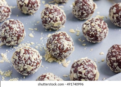 Healthy homemade paleo chocolate energy balls with rolled oats, nuts, dates and chia seeds, horizontal