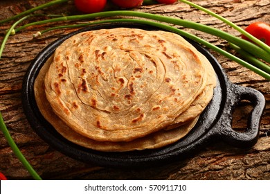 Healthy Homemade Whole Wheat Paratha On A Rustic Background. Top View-