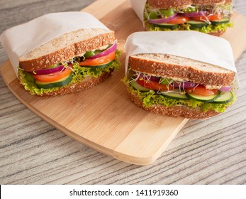 Healthy Hummus Sandwich with Alfalfa Onions Tomatoes Cucumber and Lettuce in Multi Grain Bread Slices