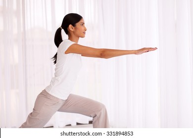 Healthy Indian Woman Practicing Yoga Exercise At Home