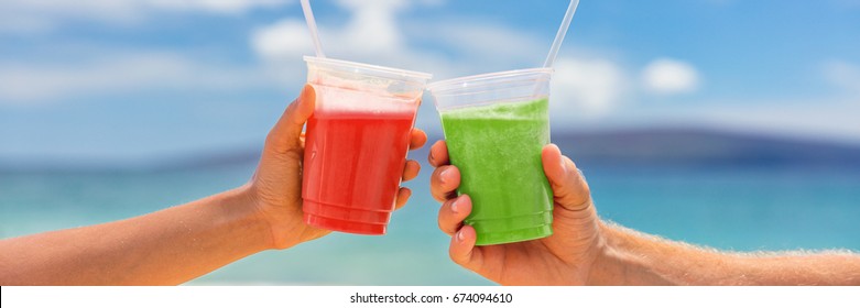 Healthy Juice Smoothie Drinking Couple Toasting Banner. Two Fruit Juices Plastic Cups Of Berry Fruits Or Beets And Green Vegetable Or Kiwi Smoothies On Summer Outdoors Background.