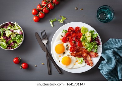 Healthy Keto Diet Breakfast: Egg, Tomatoes, Salad Leaves And Bacon