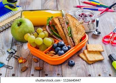 Healthy Kids Lunchbox With Sandwich, Fruits And Orange Juice