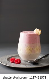 Healthy Layered Raspberry Banana Smoothie In Glass