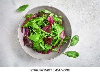 Healthy leaves mix green salad on white background. Top view. - Shutterstock ID 1806717085