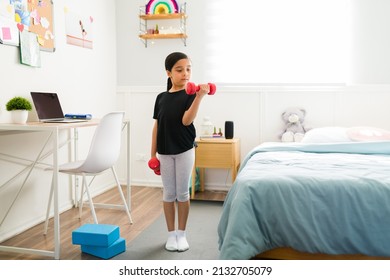 Healthy Lifestyle. Active Little Girl Lifting Dumbbells Weights And Exercising In Her Girly Bedroom 