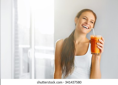 Healthy Lifestyle. Closeup Of Beautiful Smiling Vegetarian Woman Drinking Fresh Raw Detox Vegetable Juice. Healthy Food Eating, Diet And Lifestyle Concept. Drinks. Beauty Concept.