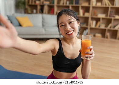 Healthy Lifestyle Concept. Fit Asian Lady Making Selfie With Fresh Juice, Drinking And Enjoying Healthy Drink For Slimming, Sitting On Yoga Mat. Weight Loss And Detox Diet Concept