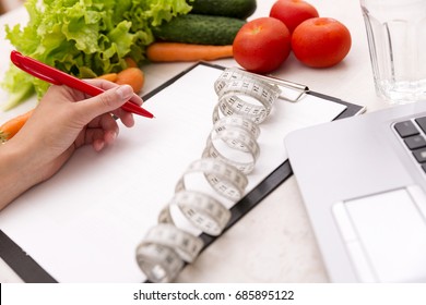 Healthy Lifestyle Concept. Writing Weight Loss Plan With Fresh Vegetable Diet And Fitness