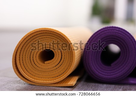 Healthy lifestyle concept. Yoga mat in light sport gym