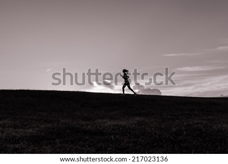 Healthy lifestyle concept - Young sporty woman running outdoor