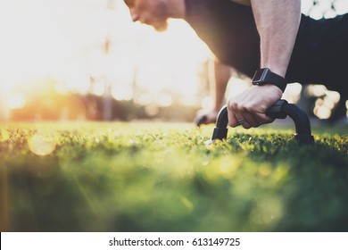 Healthy Lifestyle Concept.Muscular Athlete Exercising Push Up Outside In Sunny Park. Fit Shirtless Male Fitness Model In   Exercise Outdoors.Sport Fitness Man Doing Push-ups.Blurred Background