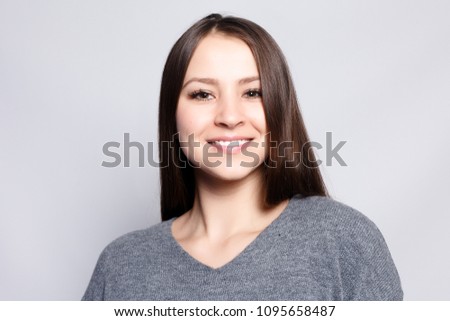 healthy lifestyle, happiness and people concept - Young beautiful cute girl showing different emotions. Background for girl a concrete gray wall. Laughing, smiling, anger, suspicion, fear, surprise.