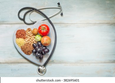 Healthy Lifestyle And Healthcare Concept With Food, Heart And Stethoscope