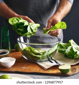 Healthy Lifestyle. Man Cooking Green Salad Of Romaine Lettuce. Healthy Food Concept