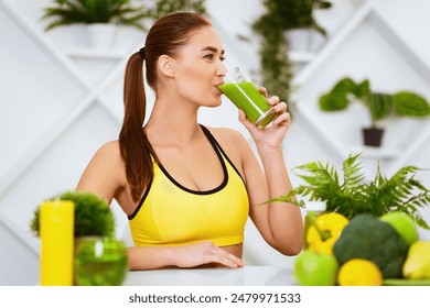 Healthy Lifestyle. Slim Girl Drinking Smoothie After Training, Sitting In Kitchen - Powered by Shutterstock