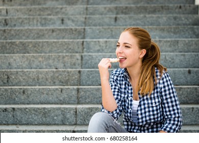 Healthy Lifestyle  - Teenager Eating Puffed Bread Outdoor Sitting On Stairs