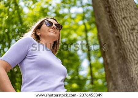 Healthy lifestyle - woman walking in city park 