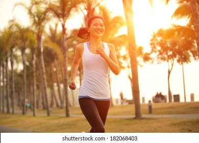 Healthy Lifestyle Young Asian Woman Running At Tropical Park 