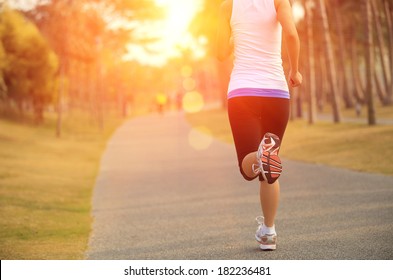healthy lifestyle young asian woman running at tropical park 